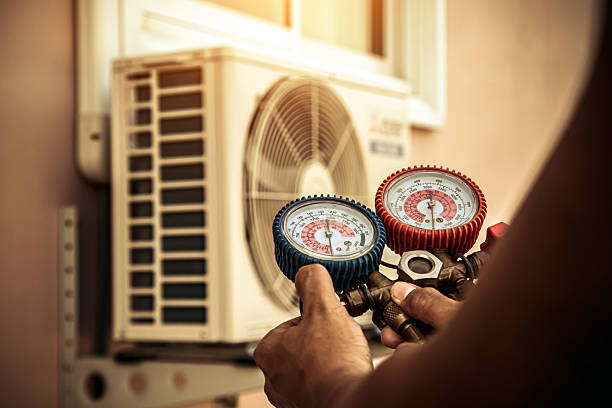 Professional Air Conditioning Service technician working in Oxford, KS